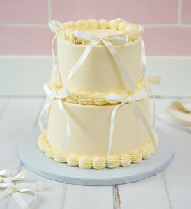 White Mini Two Tier Ribbons and Ruffles Cake