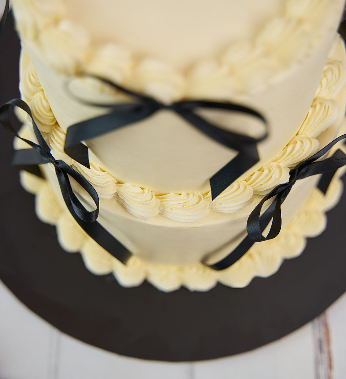 White and Black Mini Two Tier Ribbons and Ruffles Cake